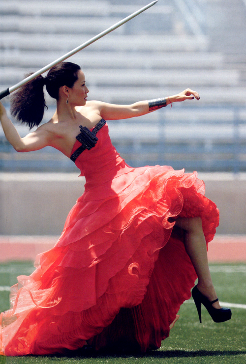 BADASS+Lucy+Liu+throwing+a+javelin+in+formal+gown+and+high+heels.
