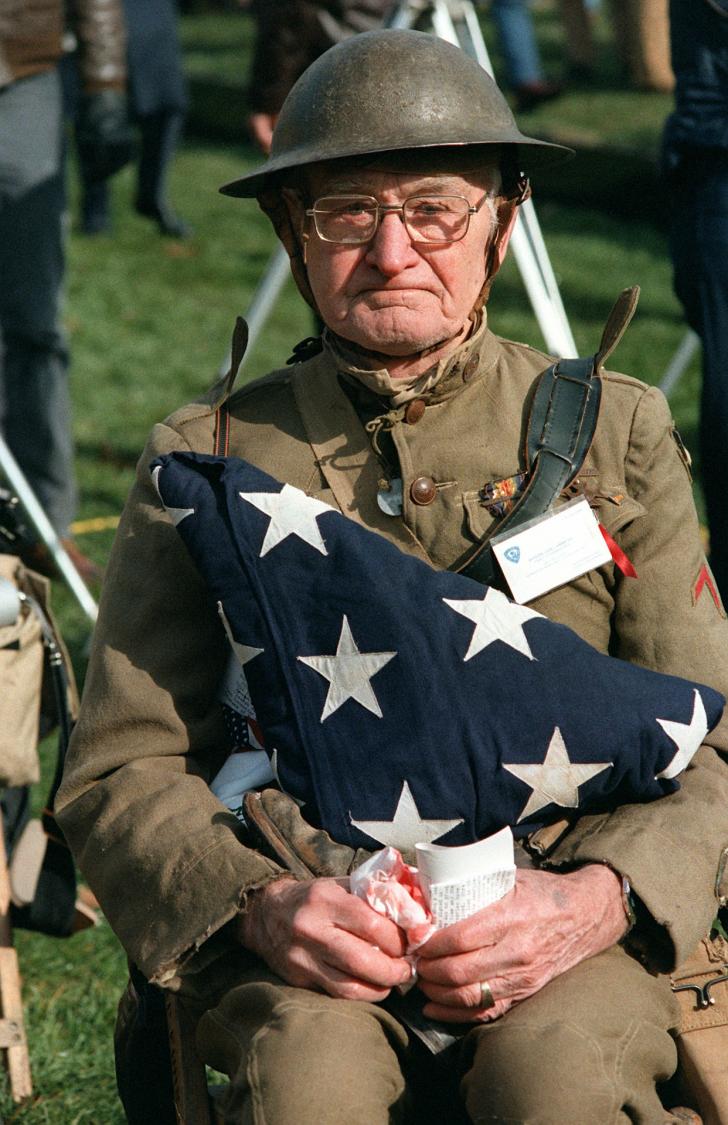 WW1+Veteran+holding+the+flag+of+his+son+that+died+in+the+Korean+war