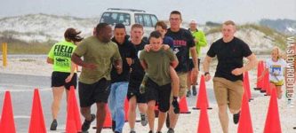 Marines+Help+A+Boy+Cross+The+Finish+Line