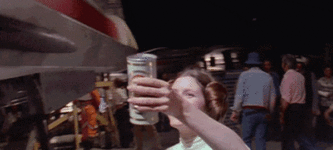 Carrie+Fisher+handing+Mark+Hamill+a+beer+%281980%29