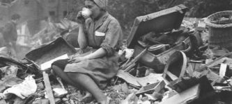 Woman+drinking+tea+after+a+German+bombing+of+London%2C+1940s