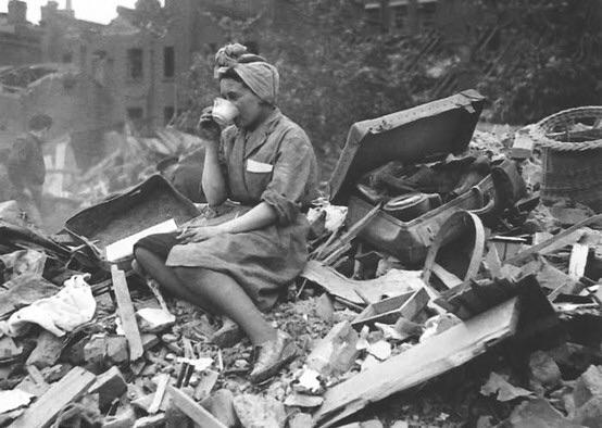 Woman+drinking+tea+after+a+German+bombing+of+London%2C+1940s