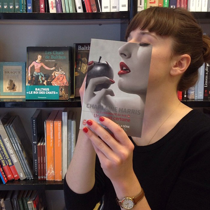 Merging+her+face+with+a+book+cover