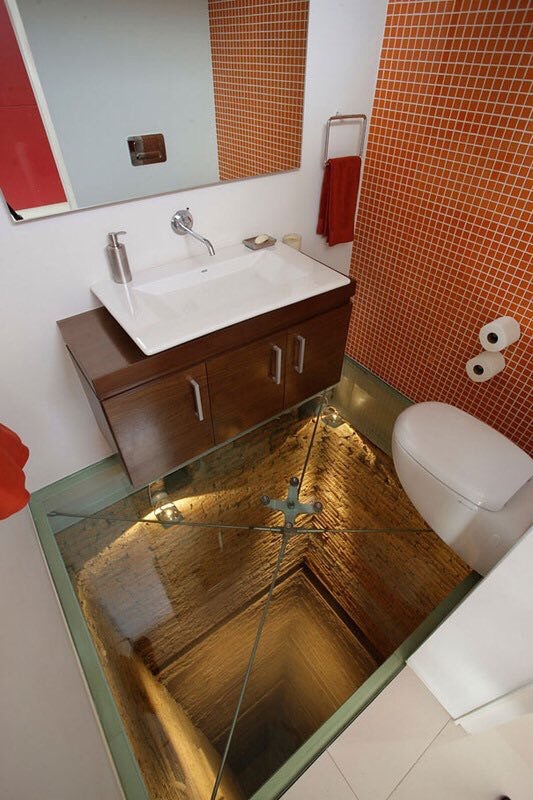 Bathroom+with+glass+floor+over+abandoned+elevator+shaft