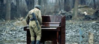 A+Russian+soldier+playing+an+abandoned+piano+in+Chechnya%2C+1994.