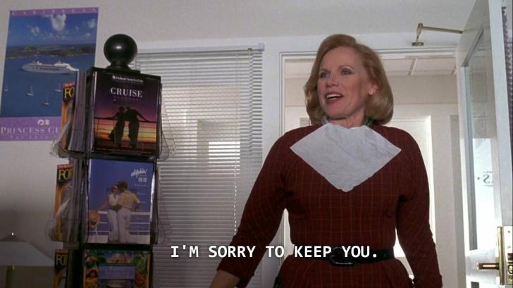 In+The+Truman+Show%2C+the+travel+agent+kept+Truman+waiting+because+she+has+never+needed+to+show+up+for+work+before.+Also+she+is+still+wearing+her+makeup+bib+since+it+was+a+rush+job.