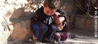 Syrian+child+trying+to+protect+his+sister+from+bombing