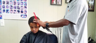 Kids+get+a+%242+discount+if+they+read+a+book+aloud+to+this+barber+in+Michigan+while+he+sorts+them+out