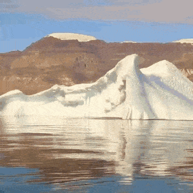 An+iceberg+rolling+over