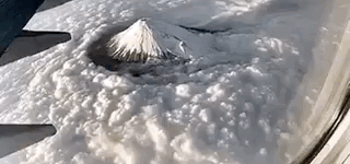 Mt.+Fuji+cutting+through+the+clouds