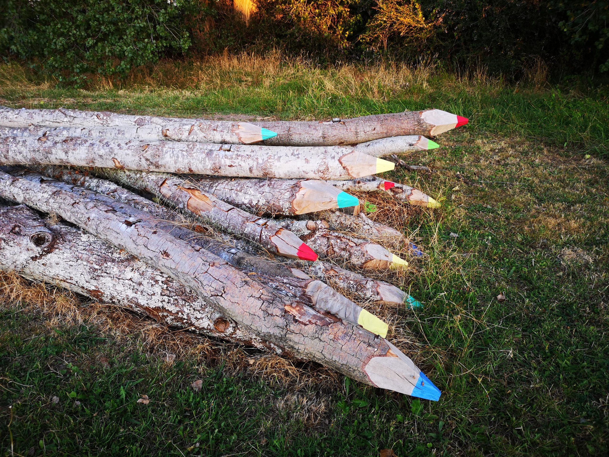 These+logs+cut+and+painted+to+look+like+giant+pencils