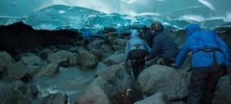 Hiking+under+a+glacier.