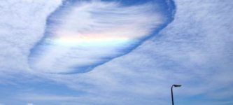 This+is+called+a+hole+punch+cloud%2C+and+its+got+a+rainbow+going+through+it