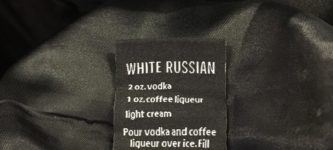 A+tuxedo+with+a+drink+recipe+on+its+tag.