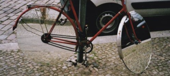 A+bicycle+with+mirrored+wheels