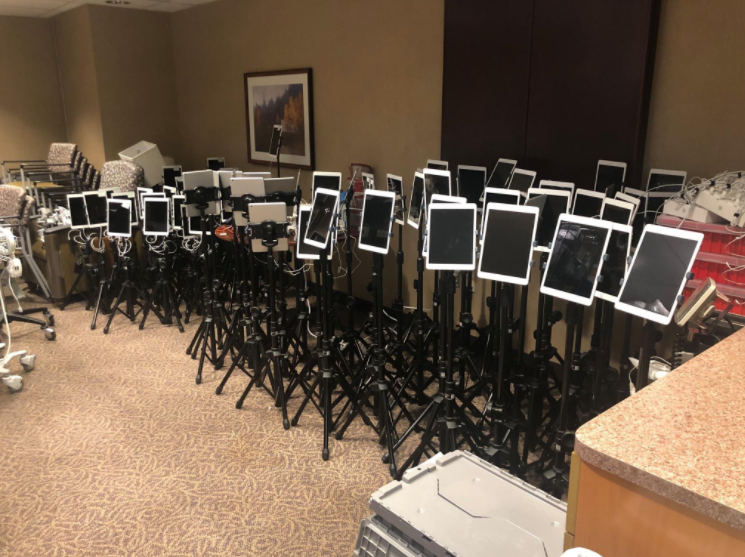 These+are+iPad+stations+being+prepared+for+virtual+end+of+life+visits+at+a+hospital.