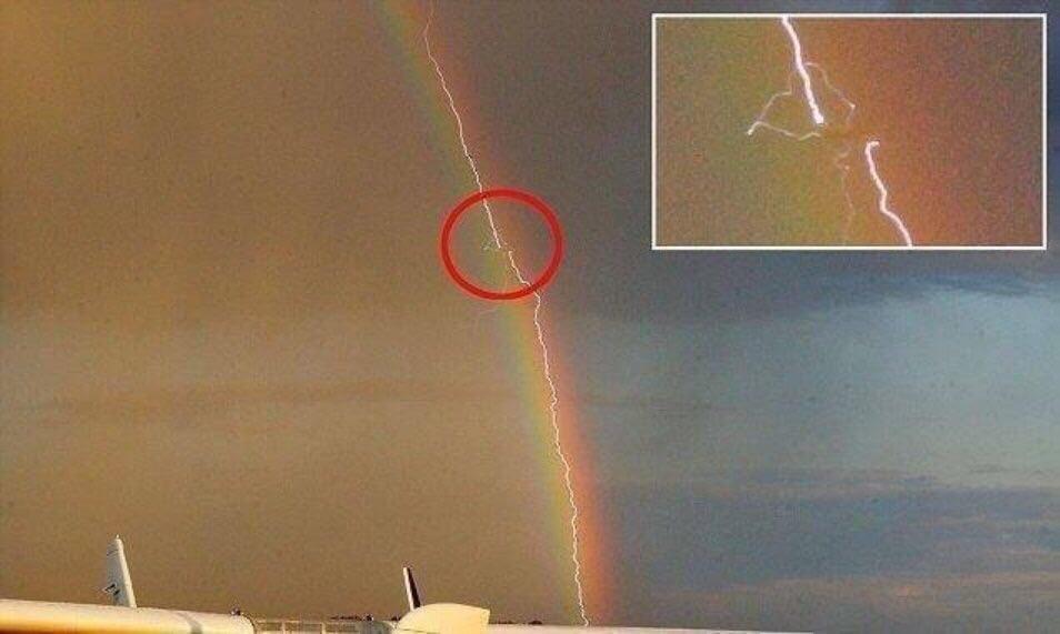 Plane+getting+hit+by+lightning+in+a+rainbow.+This+is+how+you+enter+a+wormhole%2C+probably.
